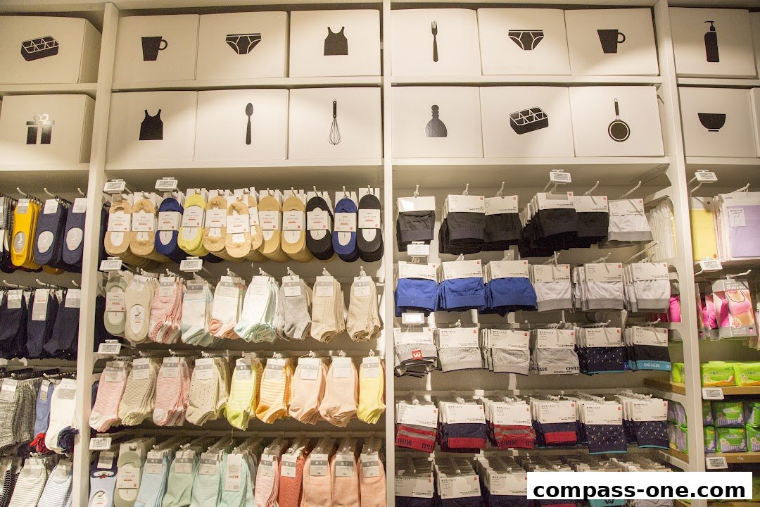 A well-organized display of socks and underwear in various colors and patterns.