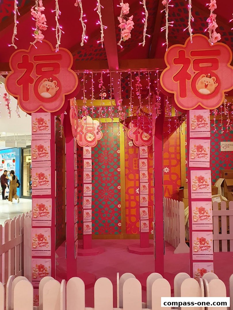 A festive pink display with Chinese characters and hanging lights, likely for a holiday celebration.