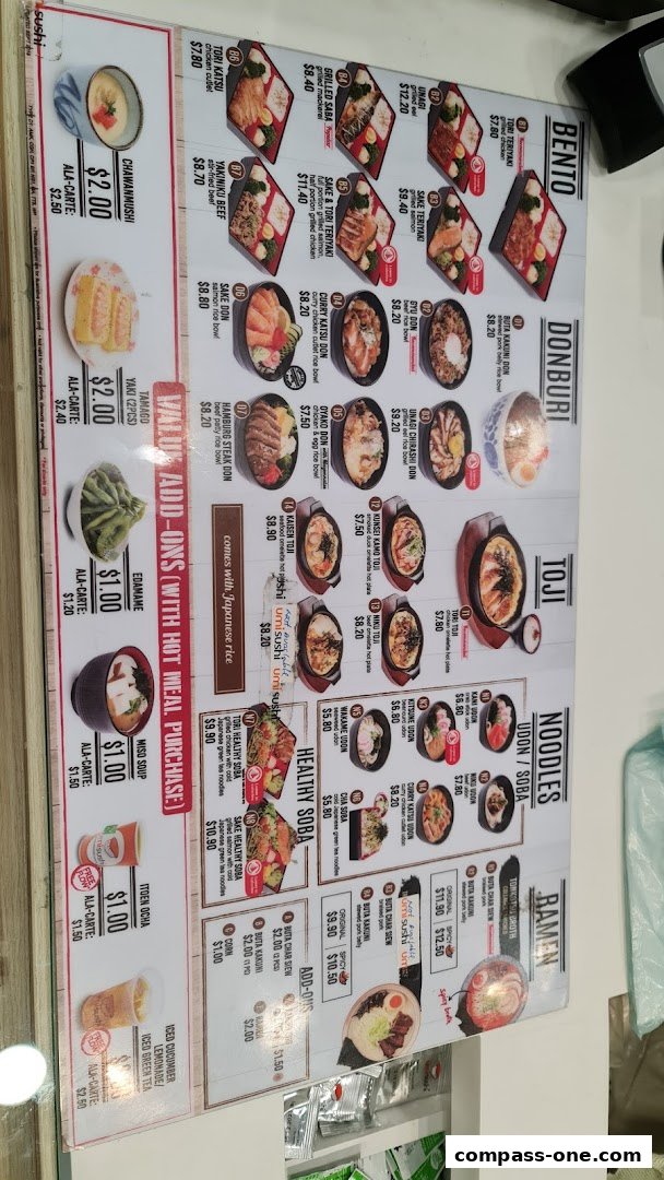 A menu board displaying various Japanese dishes including bento boxes, donburi, toji, noodles, and ramen.