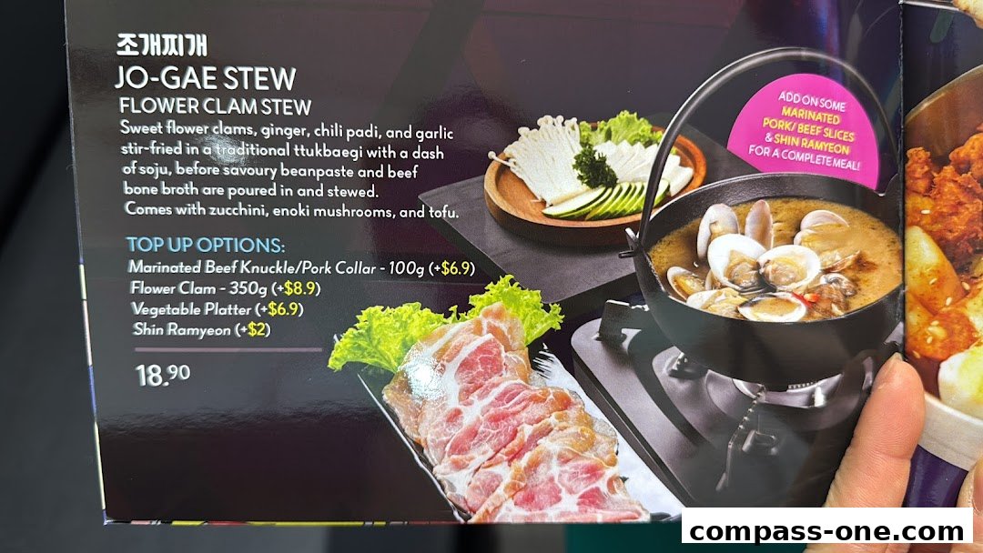 A menu item for Jo-Gae Stew, a flower clam stew with top-up options.