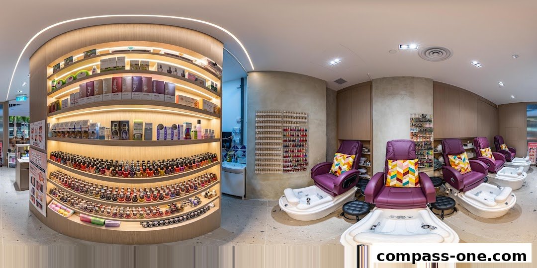Interior of a nail spa with pedicure chairs, shelves of nail polish, and retail products.