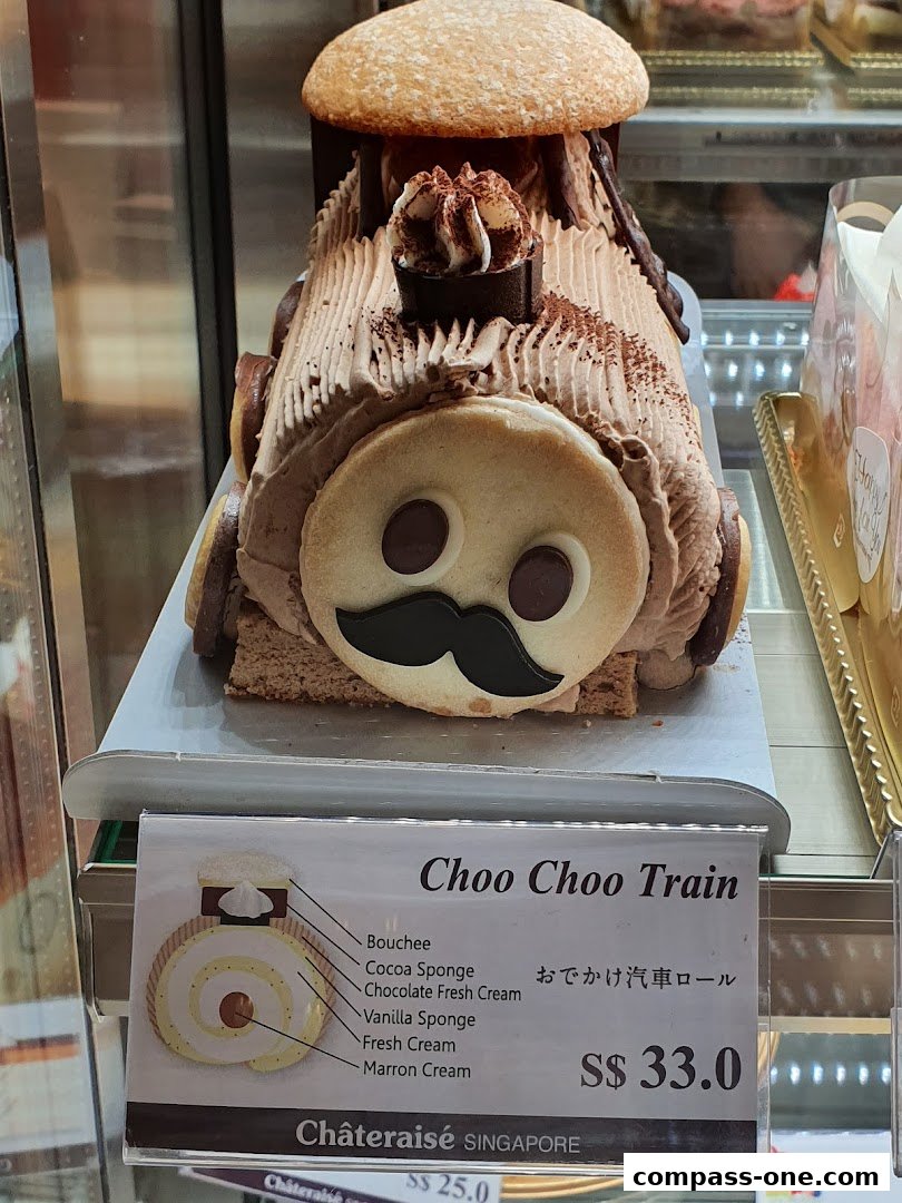 A chocolate cake shaped like a train with a price tag.