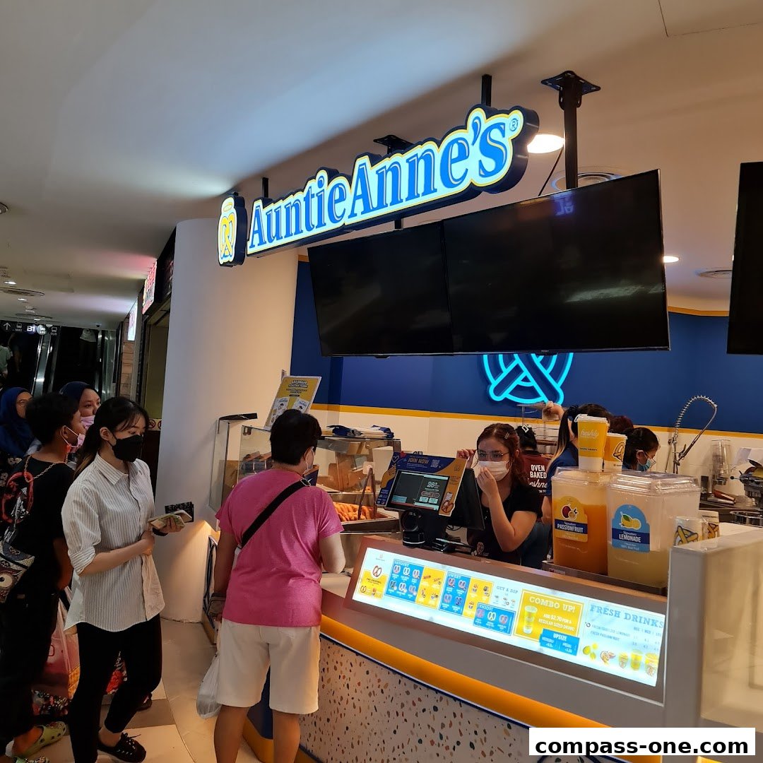 Auntie Anne's pretzel shop with customers ordering at the counter.