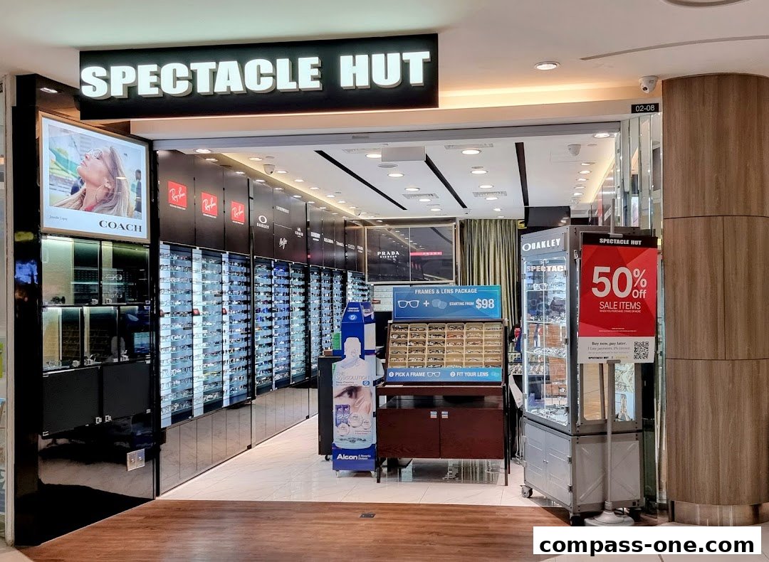 The entrance of Spectacle Hut, showcasing a wide selection of eyewear and a 50% off sale.