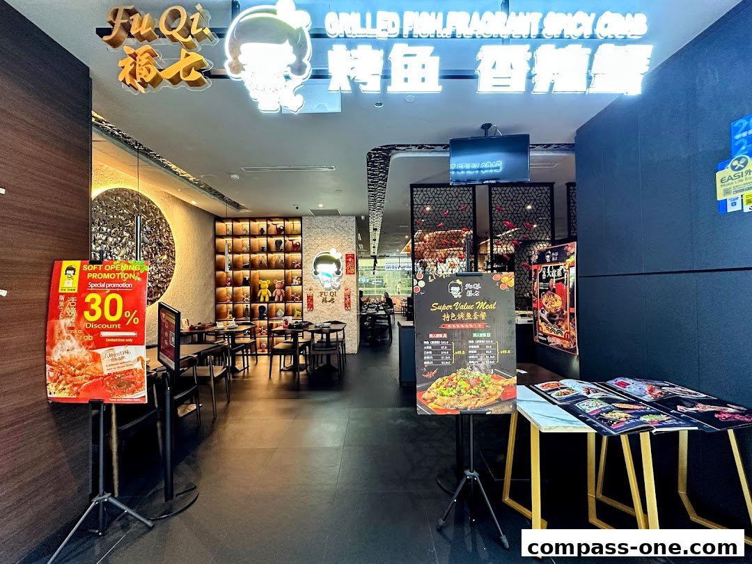 The entrance of Fu Qi Grilled Fish restaurant with promotional signs and interior seating visible.