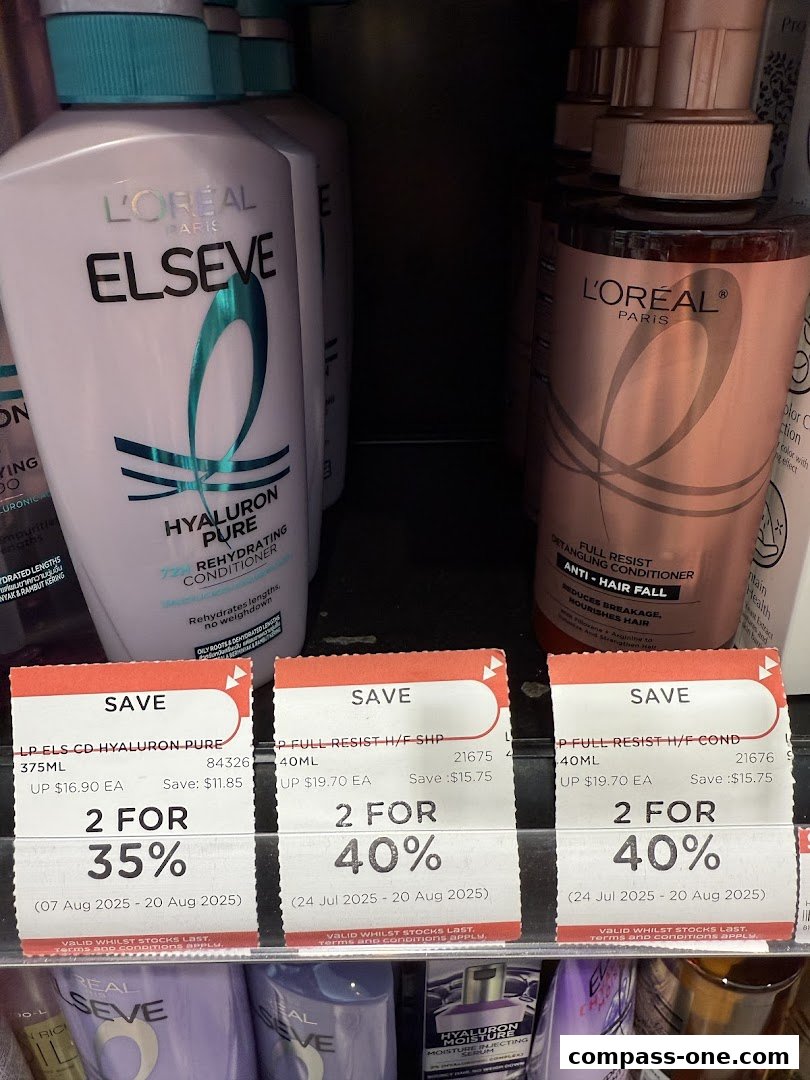 Close-up of L'Oreal Elseve hair products with promotional discount tags.