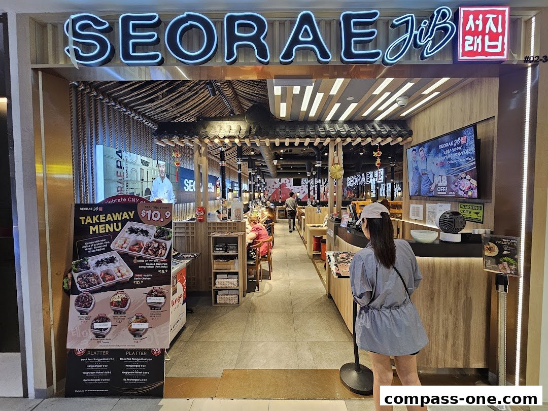 The entrance of a Korean BBQ restaurant, SEORAE JIB, with a takeaway menu displayed.