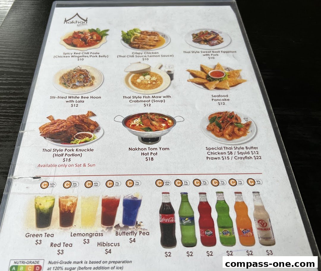 A menu from Nakhon Kitchen featuring various Thai dishes and drinks with prices.