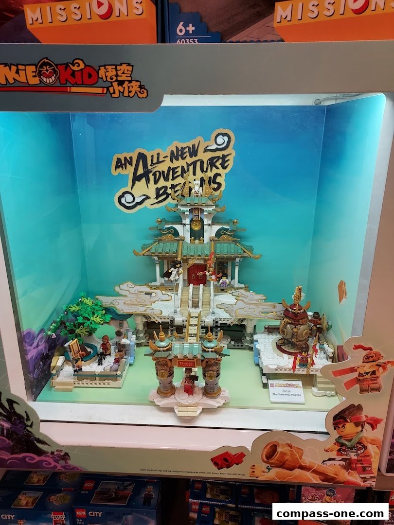 A LEGO Monkey Kid set display featuring a detailed temple and characters.