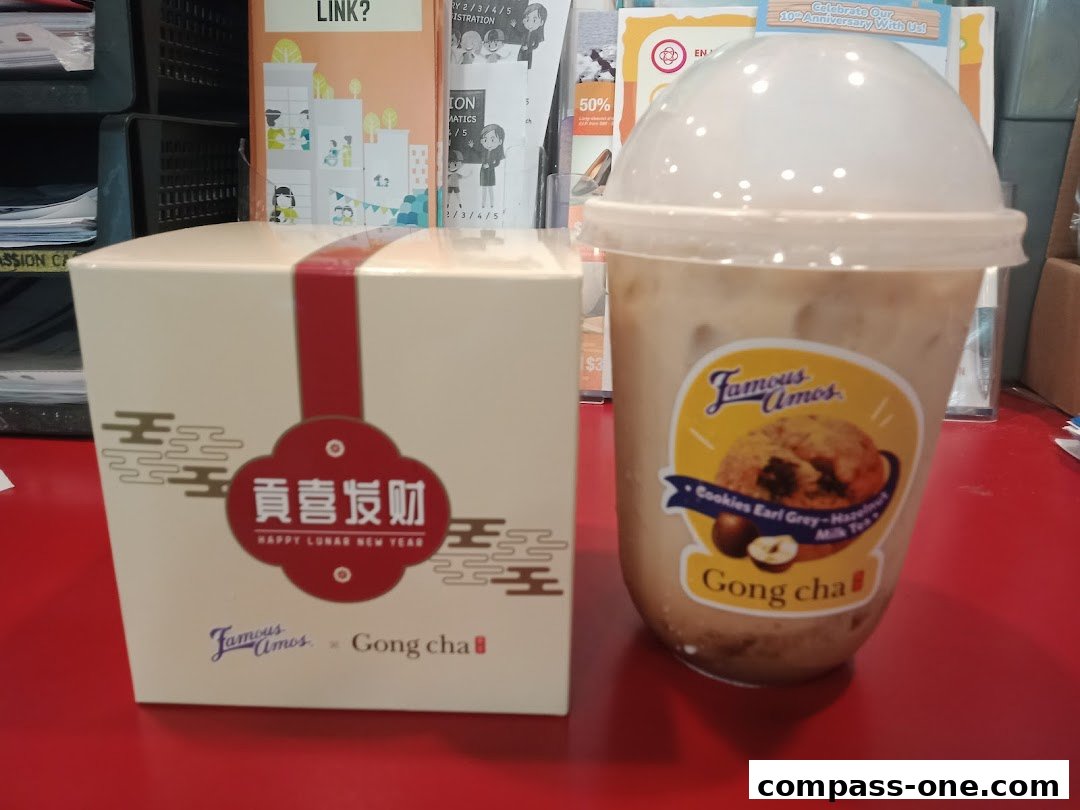 A Gong Cha milk tea and a festive box with Chinese New Year greetings.