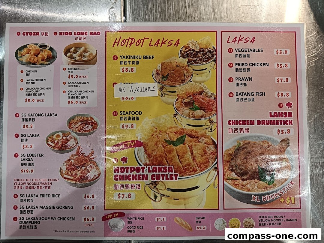 A menu board displaying various Laksa dishes, dumplings, and fried chicken with prices.