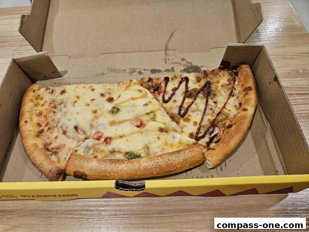 A pizza box containing three slices of pizza with different toppings and cheese.