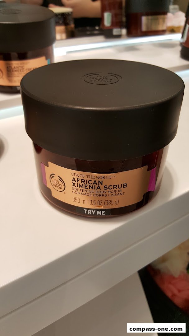 A close-up of The Body Shop's African Ximenia Scrub with a 'Try Me' label.
