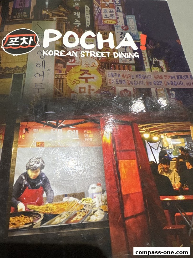 A menu cover for POCHA! Korean Street Dining featuring vibrant street scenes and food.