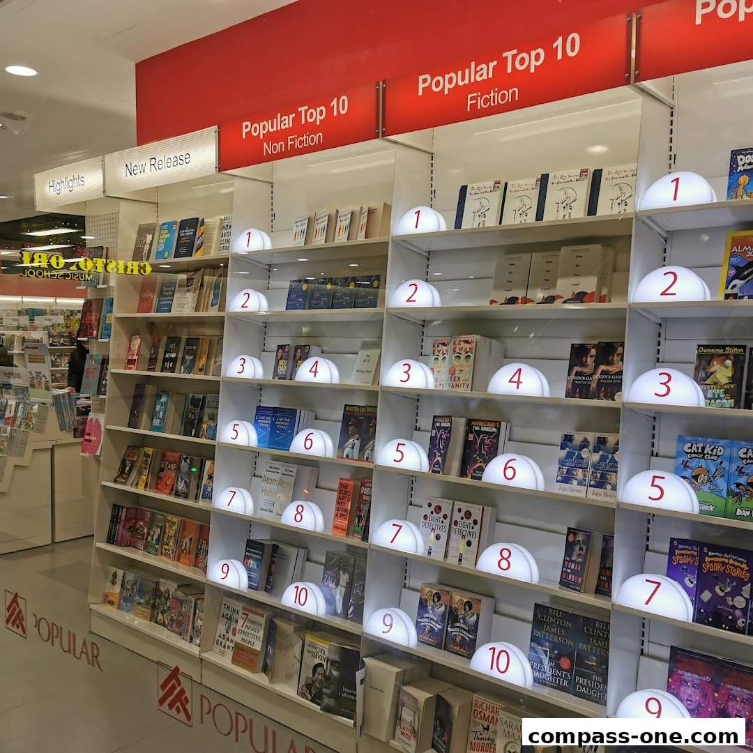 A well-lit bookstore interior showcasing shelves of books, with 'Popular Top 10' displays.