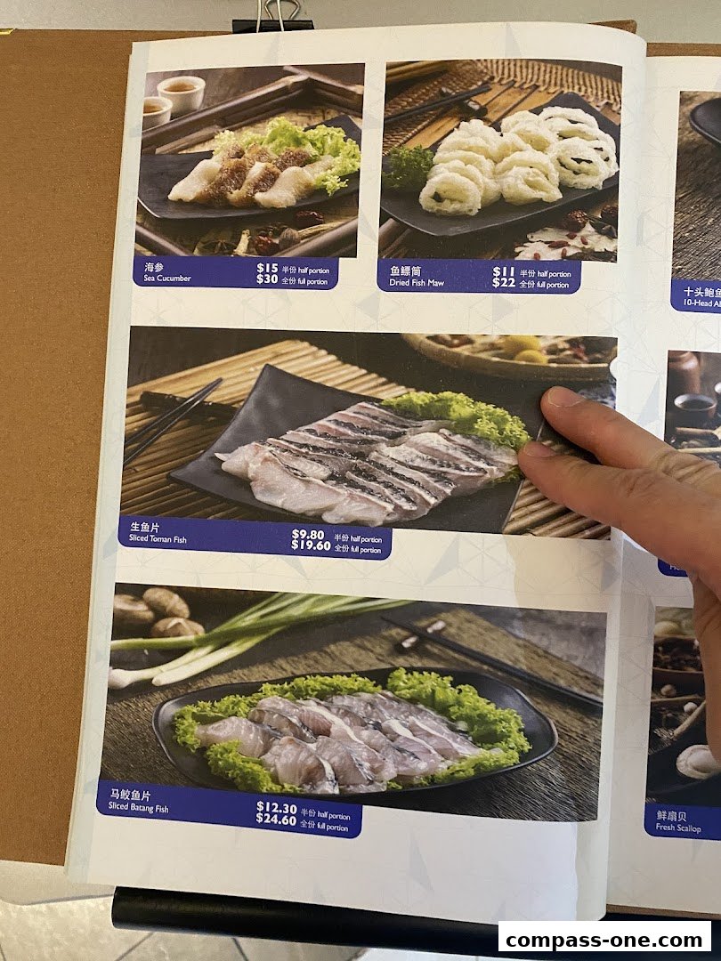 A menu showcasing various seafood dishes for hotpot, including fish and sea cucumber.