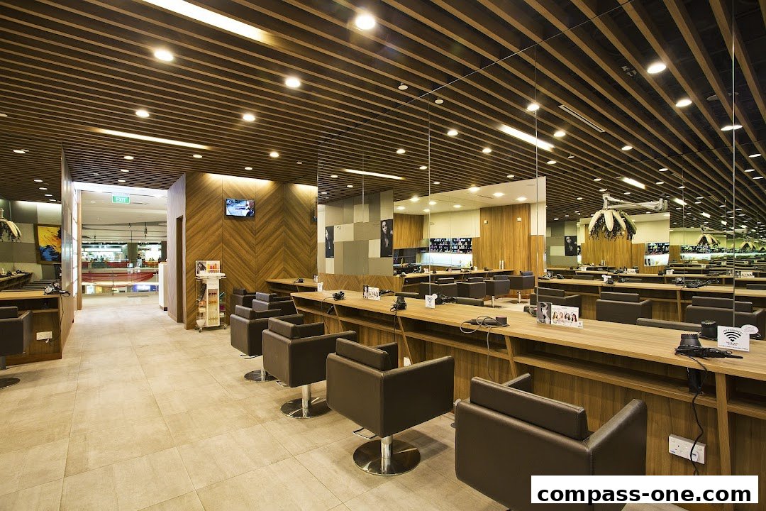 Interior view of a modern hair salon with multiple styling stations and chairs.