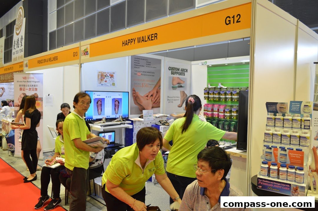 A Happy Walker booth at an event, showcasing foot care products and services.