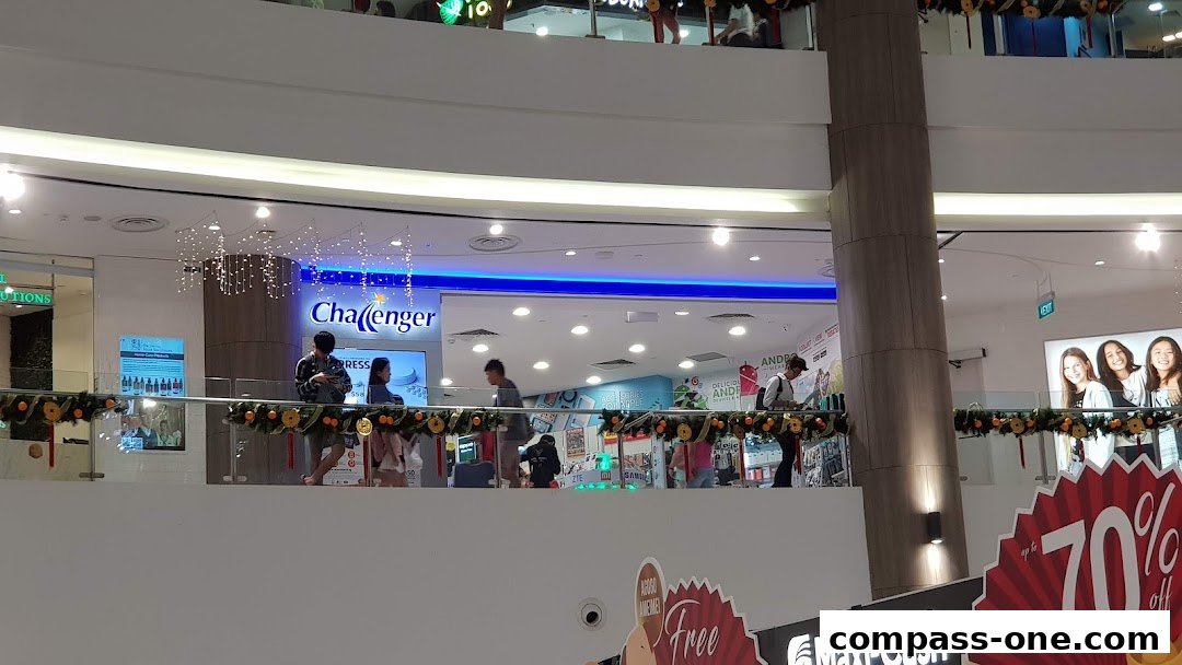 The Challenger electronics store entrance with customers browsing inside.
