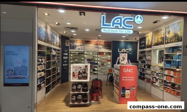 The storefront of LAC Nutrition for Life, a health and wellness store, showcasing shelves stocked with supplements.