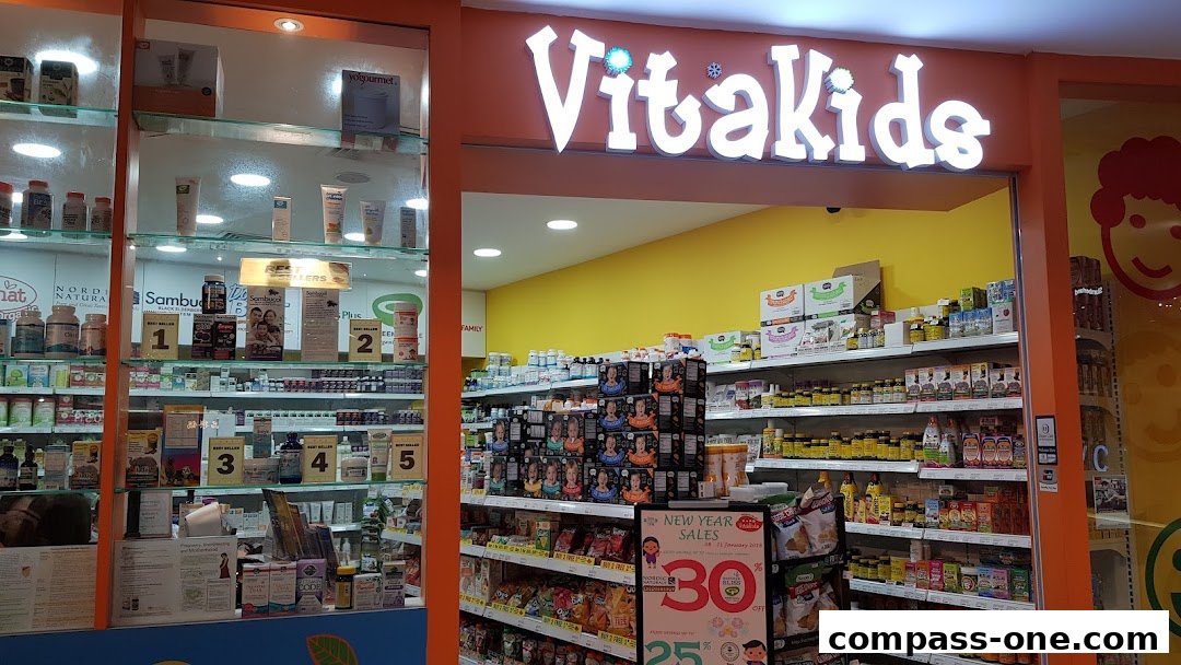 The entrance of VitaKids store, showcasing shelves filled with health supplements and products.