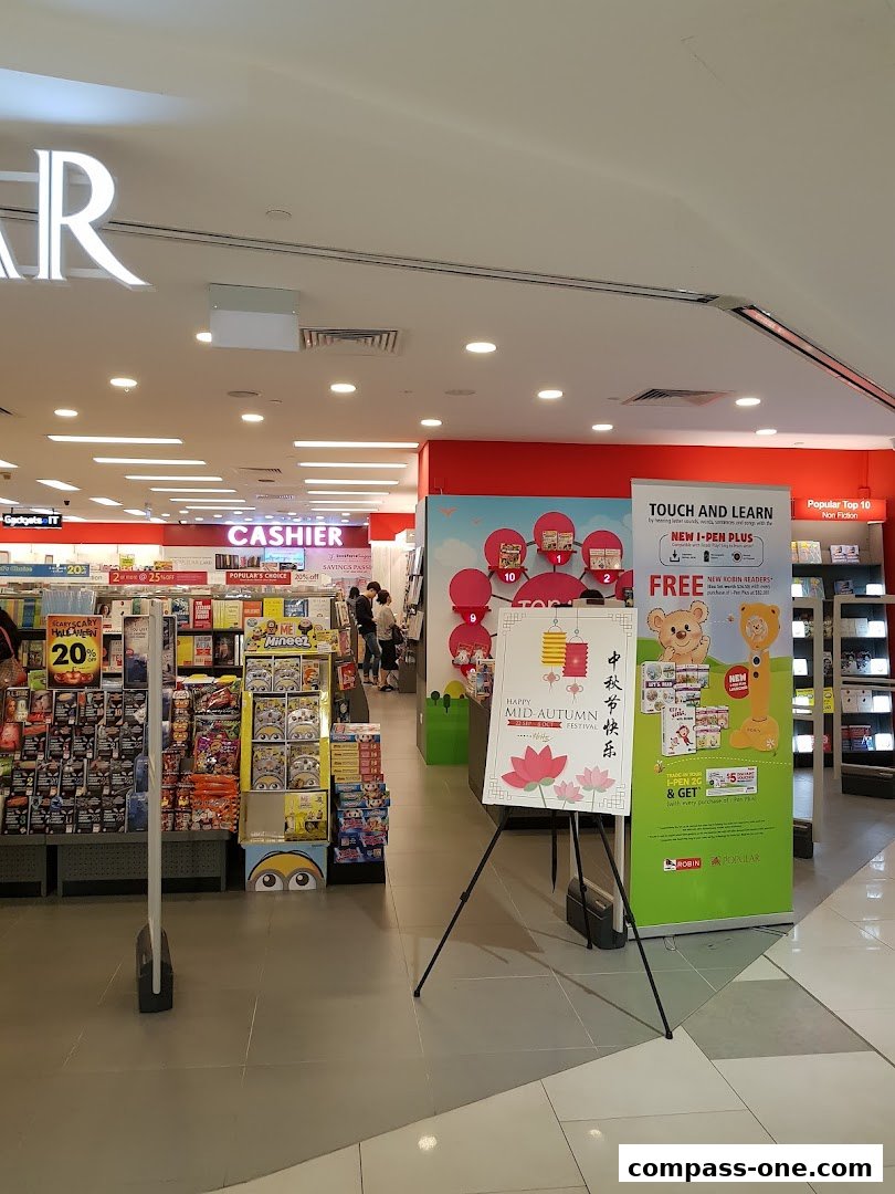 Interior view of a Popular Bookstore with displays of books, toys, and promotional posters.