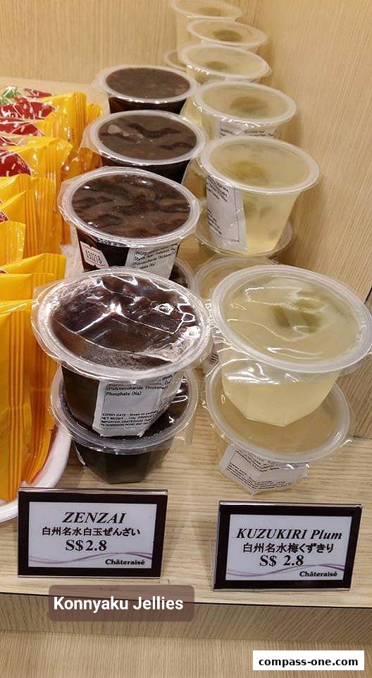 A display of Konnyaku Jellies in clear plastic cups, featuring Zenzai and Kuzukiri Plum flavors.