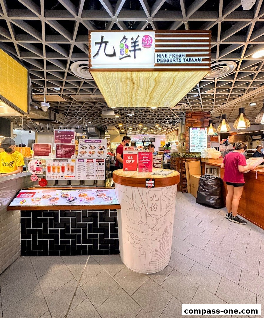 A Nine Fresh Desserts Taiwan stall with a large dessert cup display and menu boards.