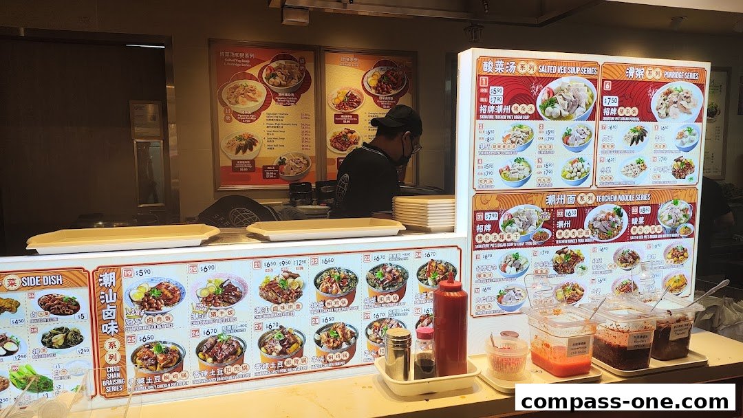 A food stall menu displaying various noodle, porridge, and side dish options with prices.