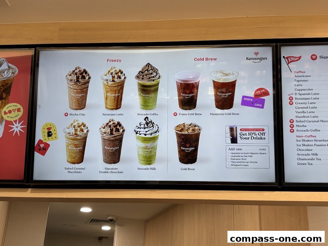 A menu board displaying various coffee drinks from Kenangan Coffee, categorized into Freezy and Cold Brew.