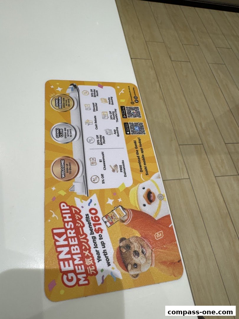 A Genki Sushi membership promotion mat featuring cartoon characters and membership benefits.