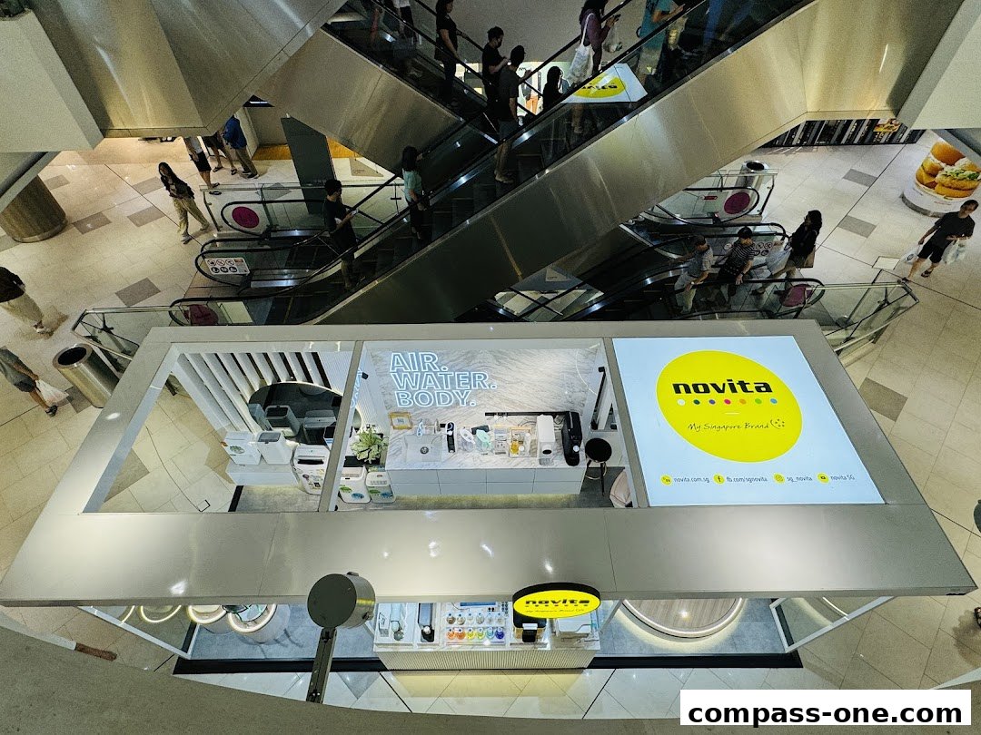 A Novita store display featuring air and water purifiers, with a large screen showing the brand logo.