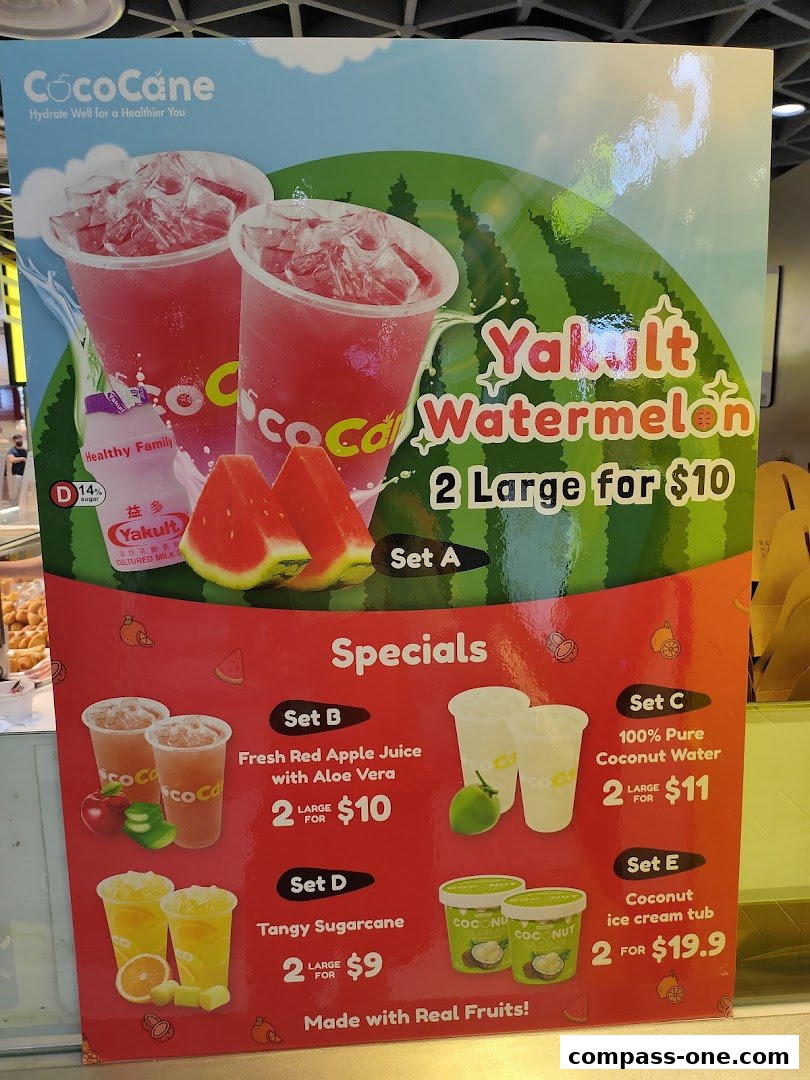 A promotional poster for CocoCane featuring Yakult Watermelon and other fruit-based drinks and desserts.