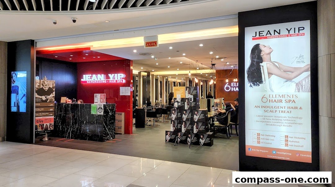 The Jean Yip Hairdressing and Hair Spa salon interior with a reception desk and styling stations.