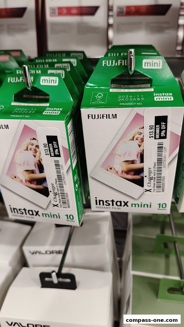 Packs of Fujifilm Instax Mini instant film are displayed on shelves at Challenger.