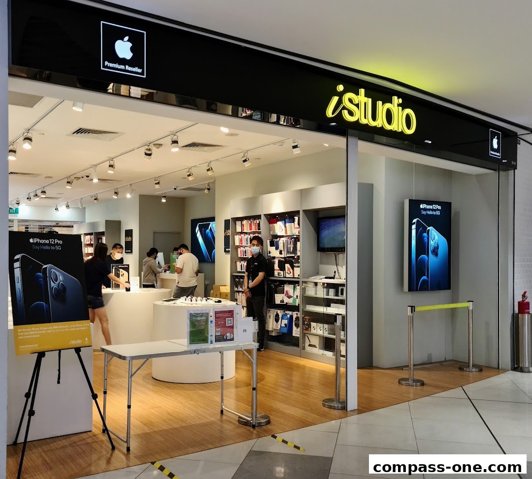 The iStudio store front, a premium Apple reseller, showcasing iPhones and accessories.