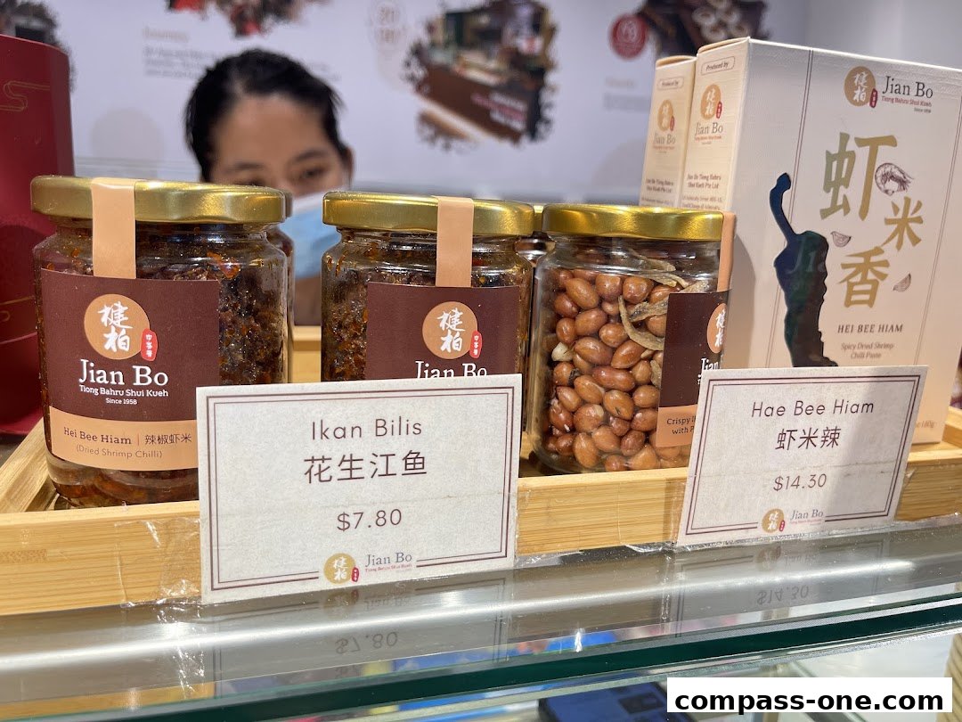 Jian Bo Shui Kueh shop displays jars of chili paste and peanuts with price tags.