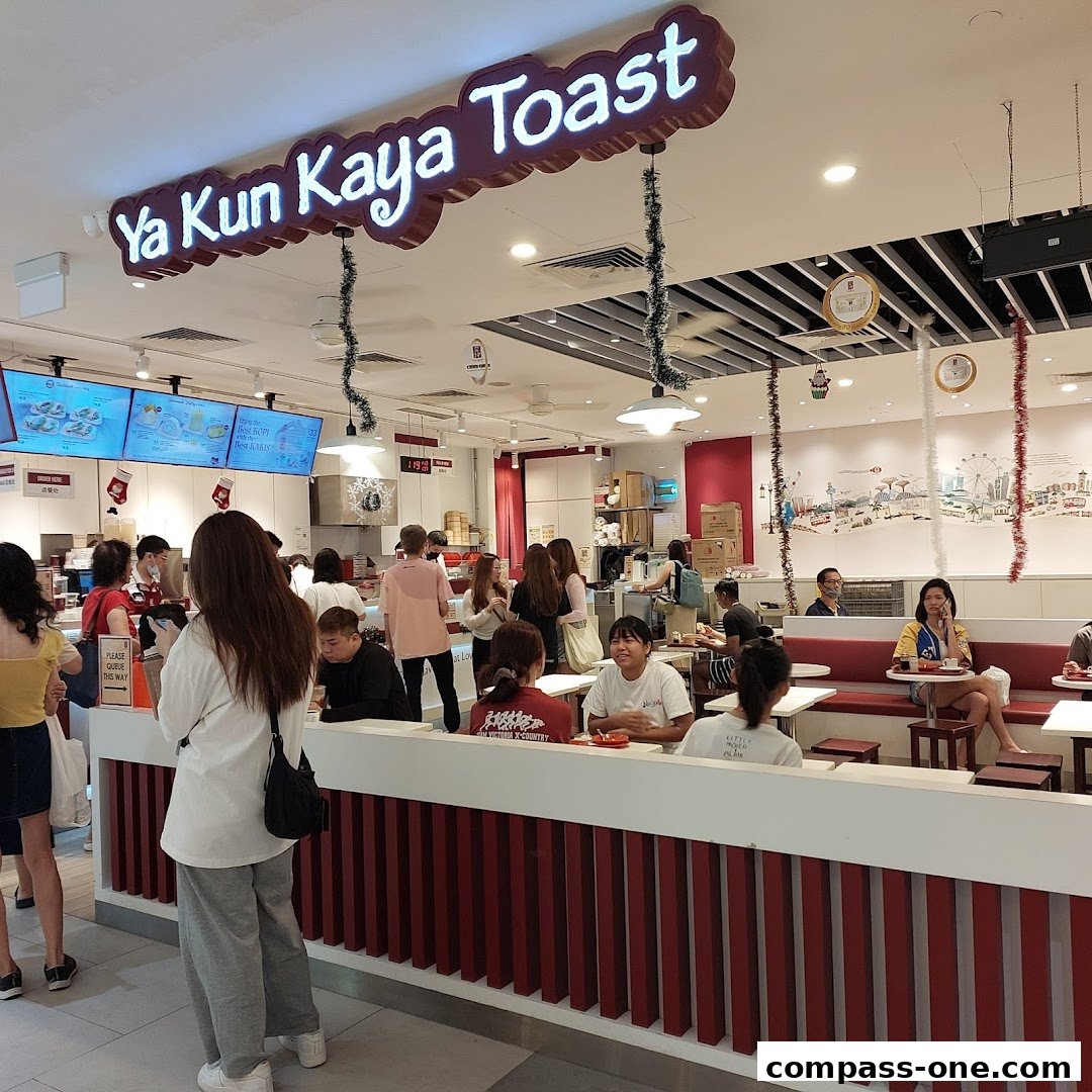 Interior view of Ya Kun Kaya Toast with customers dining and ordering.