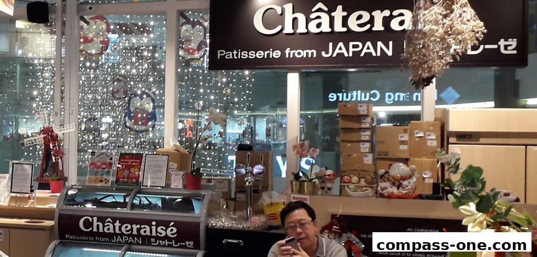 Interior view of a Châteraisé patisserie with festive decorations and products on display.