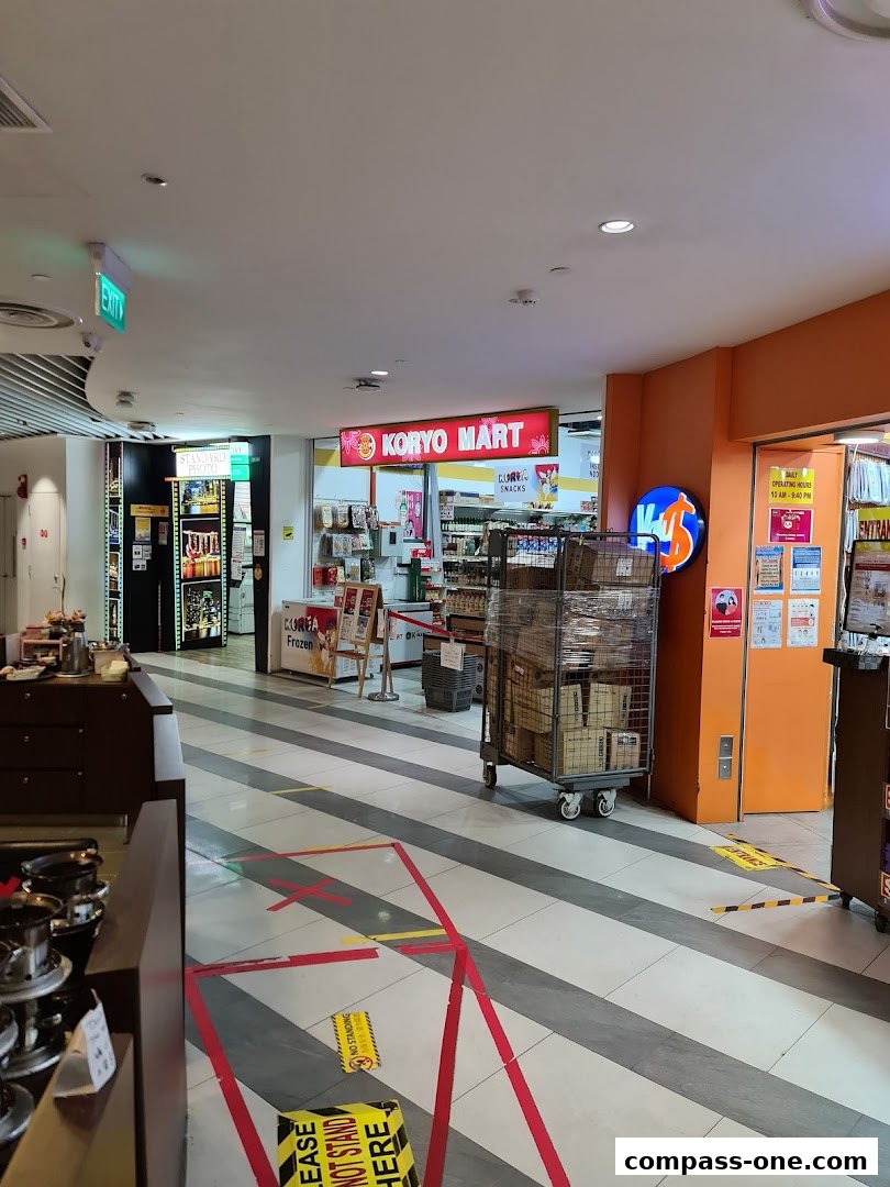 The entrance to Koryo Mart, a Korean convenience store, with social distancing markers on the floor.