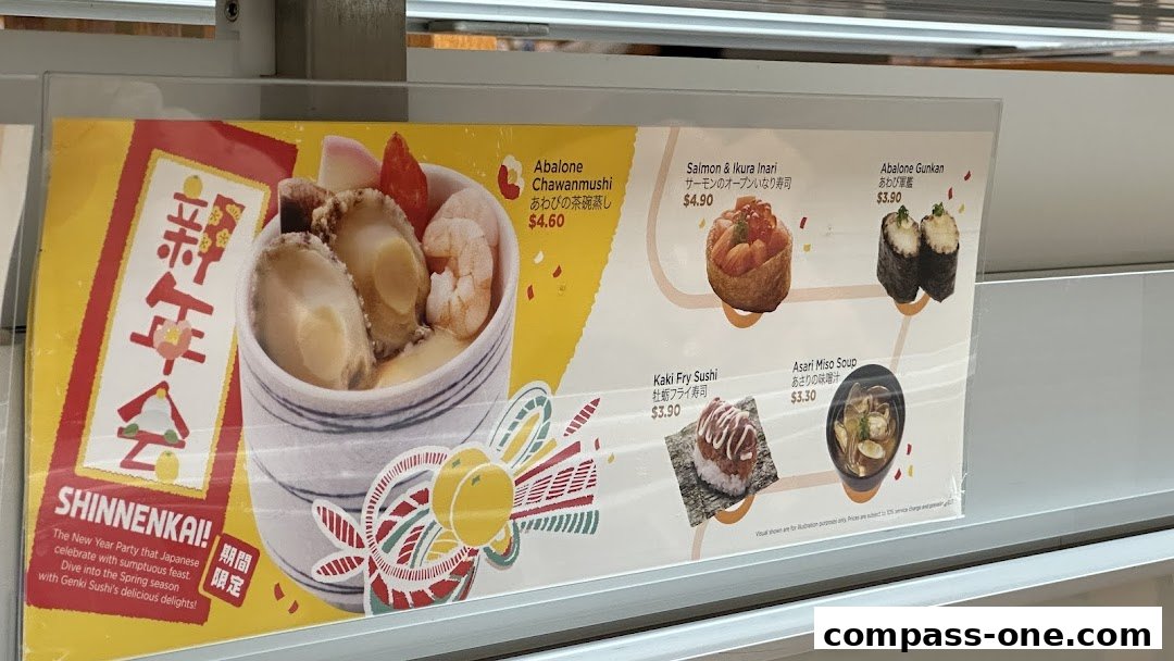 A menu display featuring Japanese dishes like Abalone Chawanmushi and Salmon Inari.