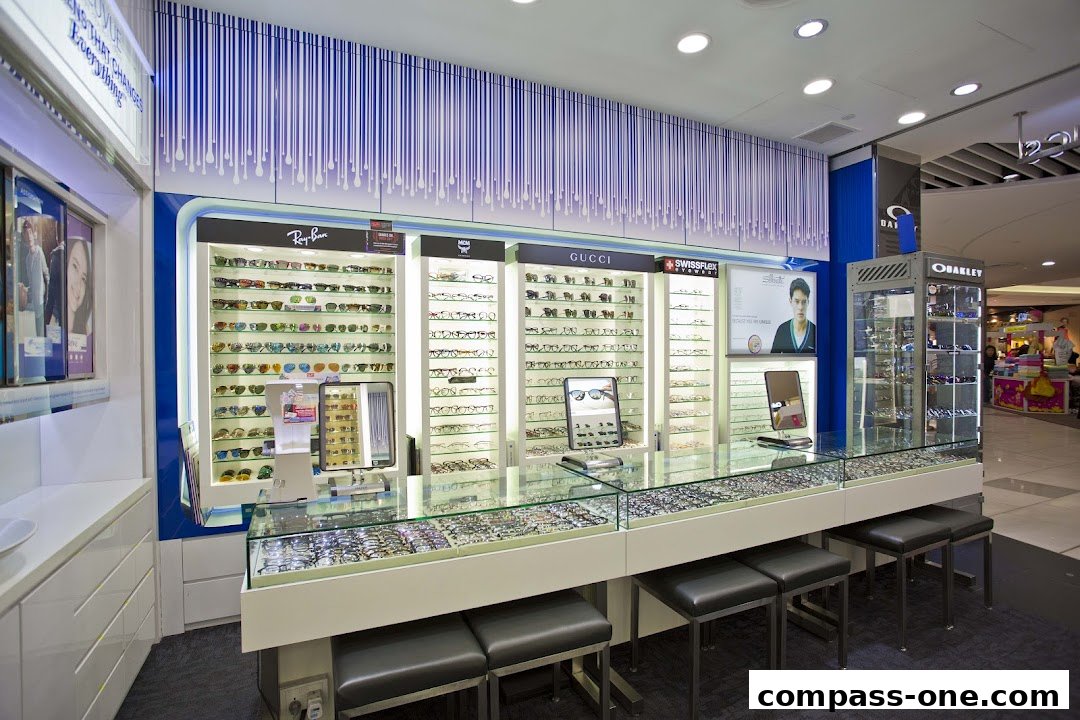 Interior view of an optical shop showcasing a wide selection of eyeglasses and sunglasses.