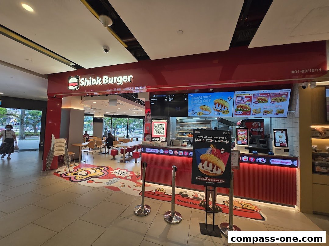 The exterior of Shiok Burger, a fast-food restaurant with a bright red and white facade.