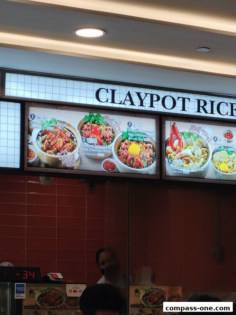 A menu board displaying various claypot rice dishes with prices and images.