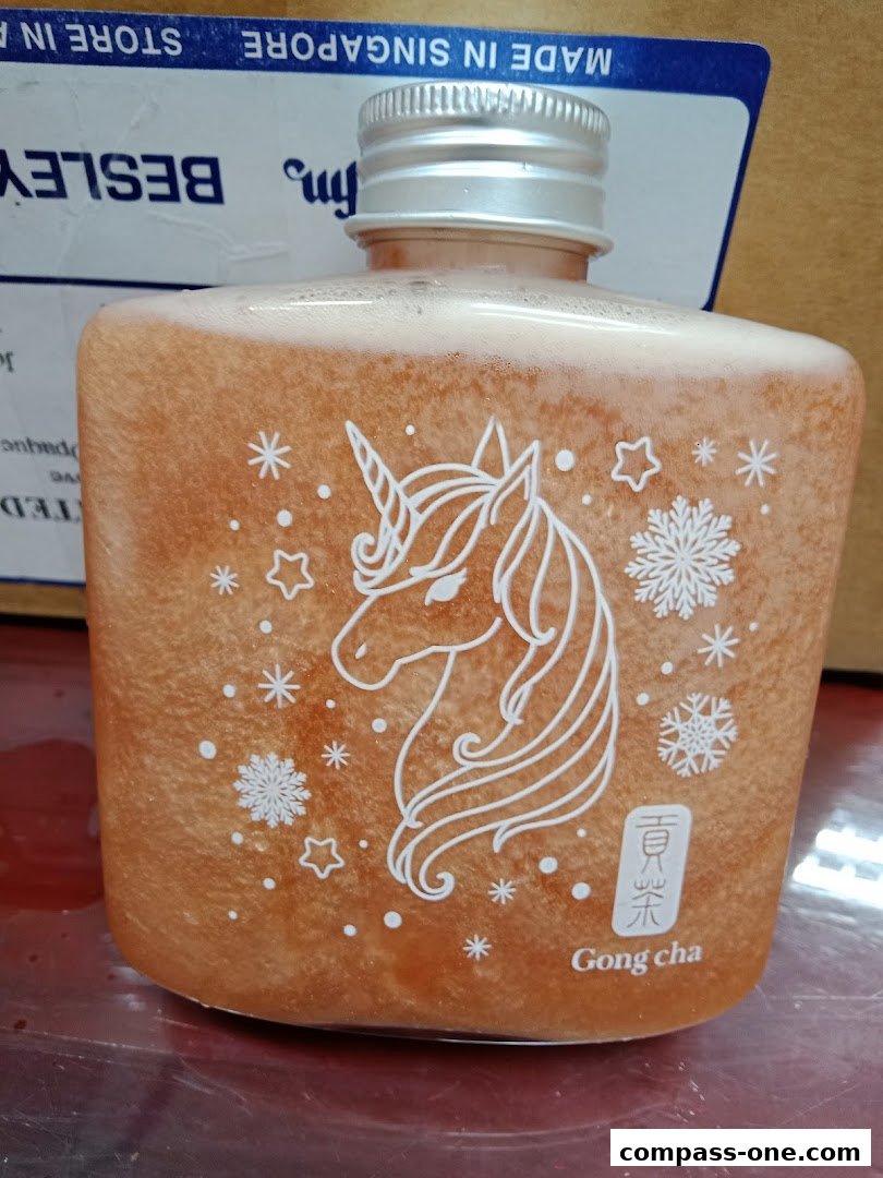 A bottle of Gong Cha drink with a unicorn and snowflake design.