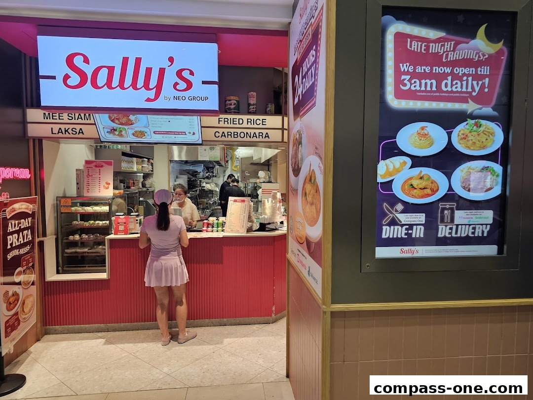 Sally's Compass One shop with staff serving customers and a late-night dining advertisement.