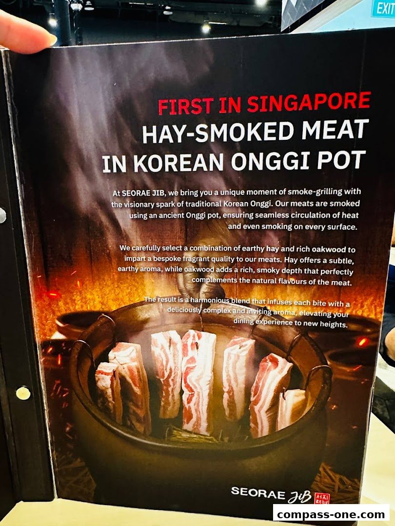 A brochure showcasing hay-smoked meat cooked in a Korean Onggi pot at SEORAE JIB.
