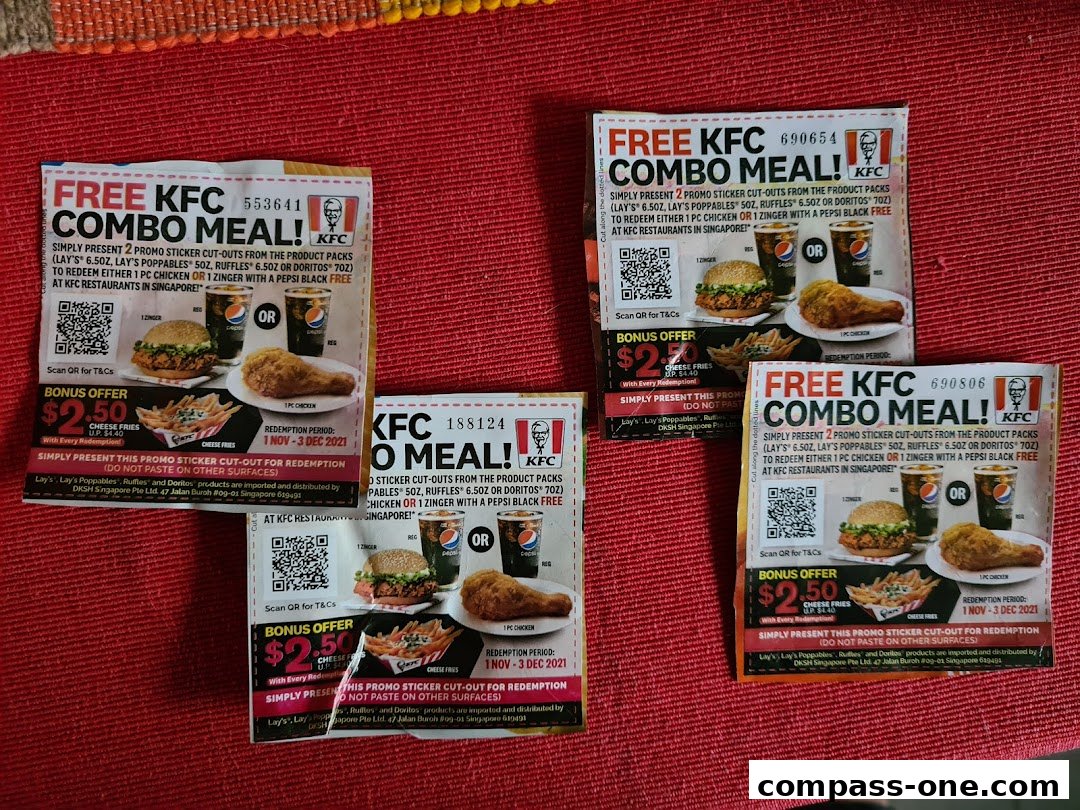 Several promotional flyers for KFC's free combo meal offer are displayed.