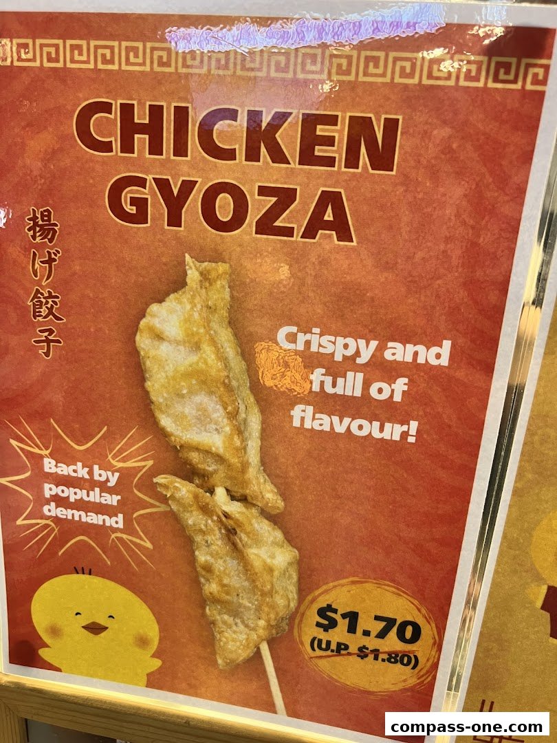 A sign advertising Chicken Gyoza, highlighting its crispy texture and flavor, with a special price.