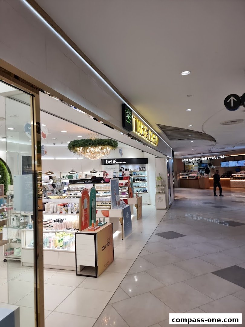 The exterior of THEFACESHOP, a beauty store, showcasing its products and entrance.